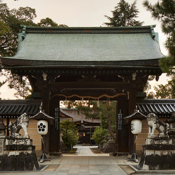 Traditional gate with turquoise roof at Kitano Tenmangu Shrine, Aman Kyoto.