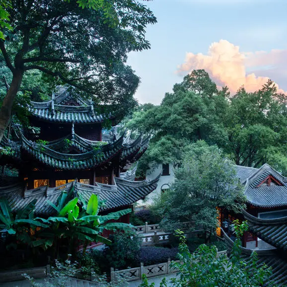 Traditional pavilions and temples nestled among lush vegetation at Amanfayun, Hangzhou.