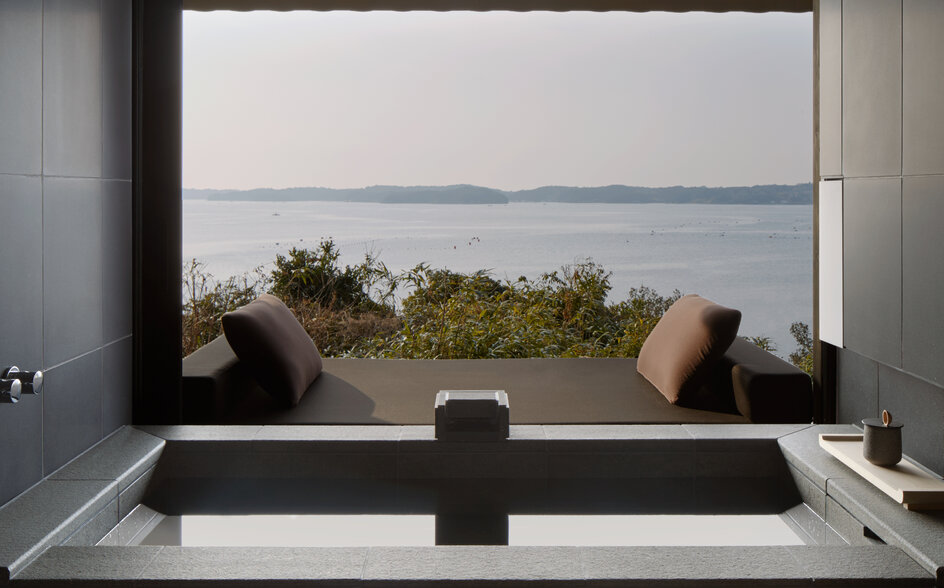 Soaking tub at Amanemu with views across Matsushima Bay towards distant islands.