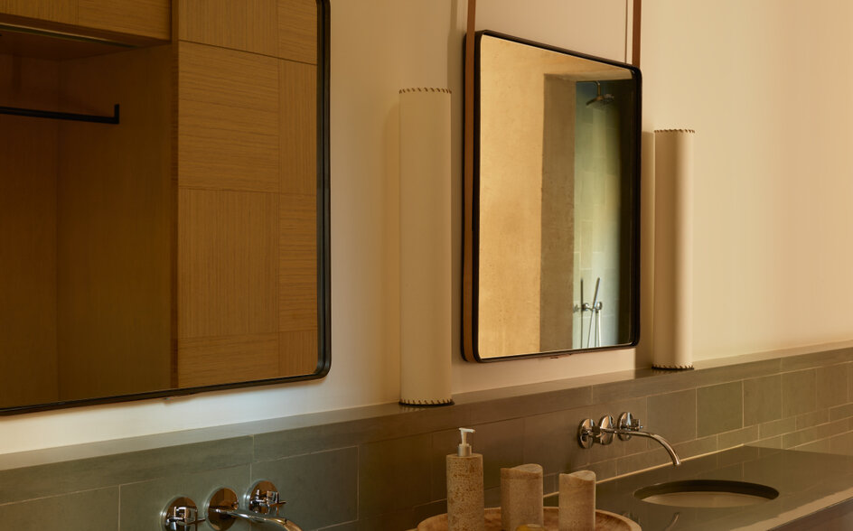 Mesa Suite bathroom with dual sinks, mirrors, and warm earth-toned finishes at Amangiri.