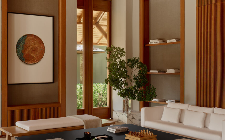 Three-bedroom villa living area at Amanyara with wooden architectural details and modern furnishings.