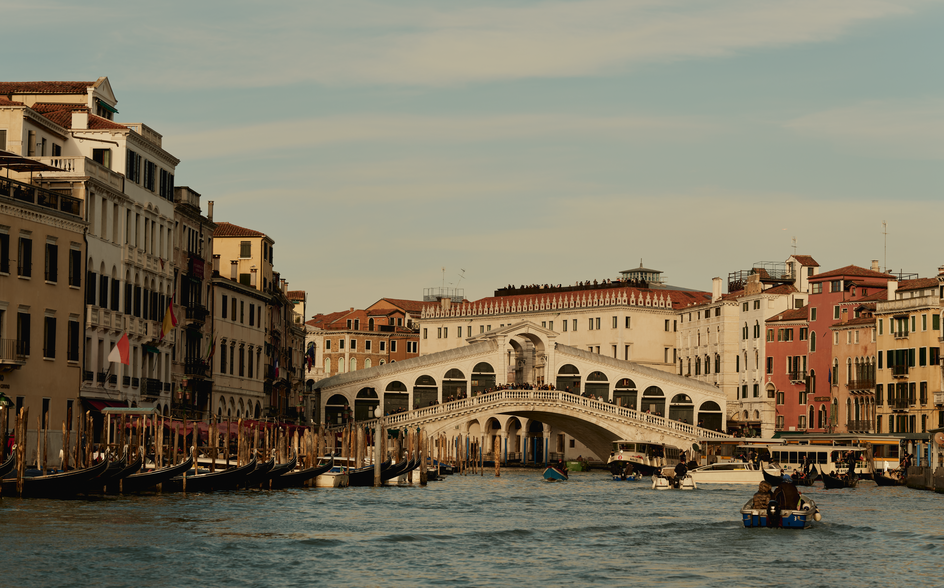 Venetian palaces and the Rialto Bridge viewed across the Grand Canal at Aman Venice.