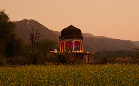 Chhatri pavilion lit at dusk for dinner, Amanbagh.
