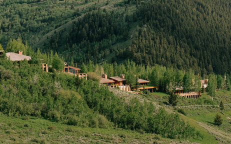 Amangani residences scattered across a forested mountainside in Jackson Hole.