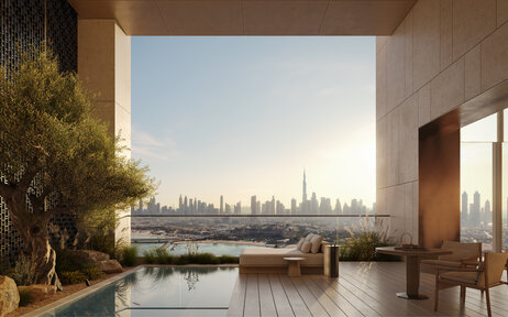 External terrace at Aman Dubai with plunge pool overlooking the city skyline at dusk.