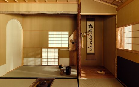 Wooden tea house interior at Aman Kyoto with tatami mats, sliding screens and natural light.