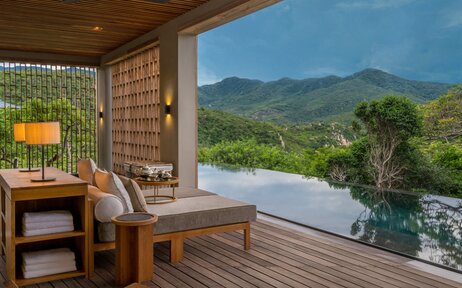 Forest Wellness Pool Villa relaxation area at Amanoi with views over the Vietnamese landscape.