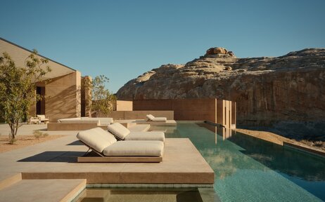 Six-bedroom villa pool terrace at Amangiri overlooking desert landscape at dusk.