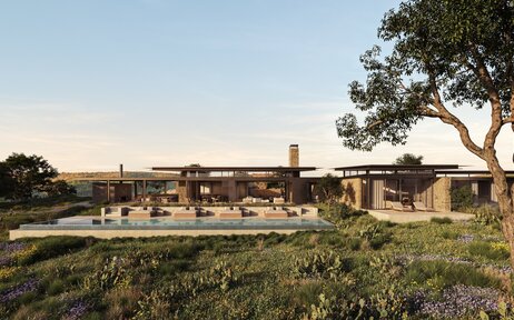 Aman Residences Amansanu exterior with poolside pavilion and manicured gardens at dusk.