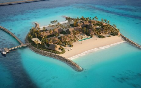 Double Beach Island Residence at Amanolu surrounded by turquoise waters and white sand.