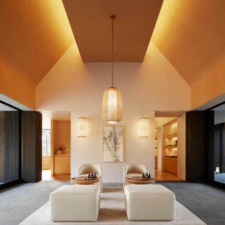 Amanemu resort gallery: serene spa interior with vaulted ceiling, warm ambient lighting, and minimalist furnishings.