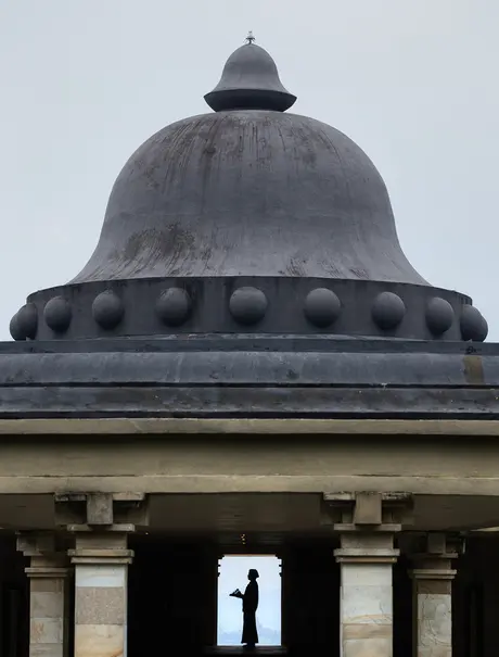 Domed roof with circular details at Amanjiwo, framed by classical columns below.