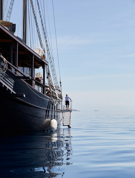 Exterior view of Amandira's vessel moored in calm blue waters.