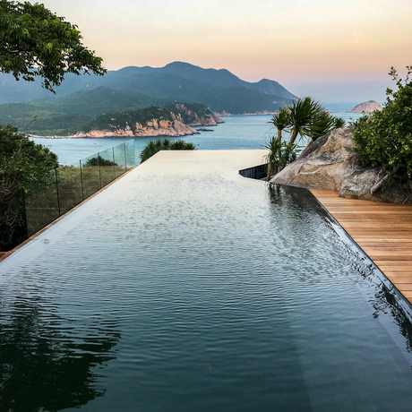Infinity plunge pool overlooking Halong Bay at Amanoi at sunset.