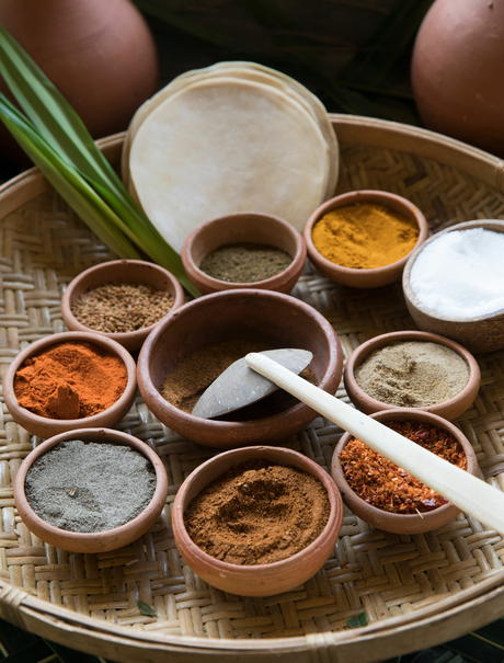 Overhead view of various spices and seasonings arranged in small bowls at Amanwella.