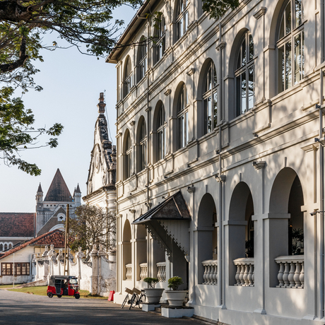 Amangalla's colonial architecture with arched verandahs and period details facing a quiet street.