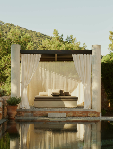 Garden View Pavilion with daybed beside reflecting pool at Amanruya, Turkey.