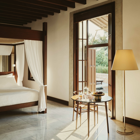 Principal bedroom at Amanruya with partial sea view from pavilion doors.