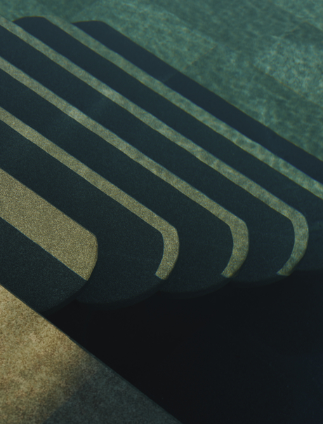 Overhead view of poolside loungers casting geometric shadows at Amanruya, Turkey.