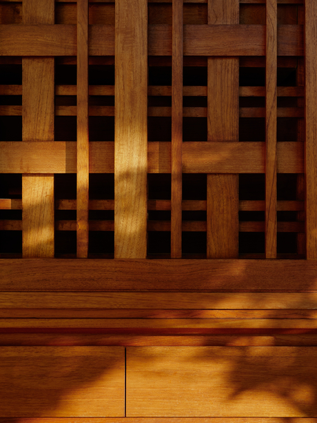 Wooden terrace at Amanera with golden evening light casting shadows across the floor, Dominican Republic.