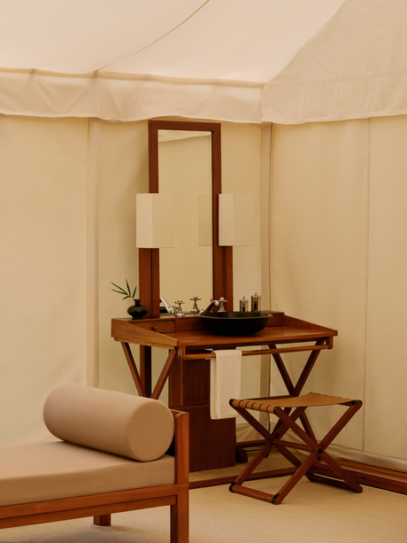 Bathroom vanity with mirror and wooden furnishings inside a tent at Aman-i-Khas.