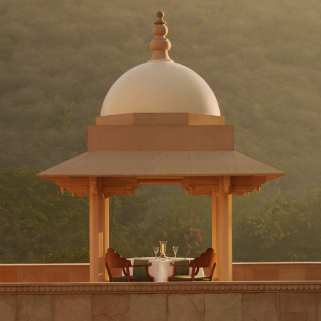 Amanbagh's main building exterior featuring a domed pavilion with terracotta columns and cream dome.