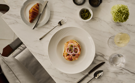 Breakfast spread at Amanera resort with plated dishes and fresh ingredients on a marble table.