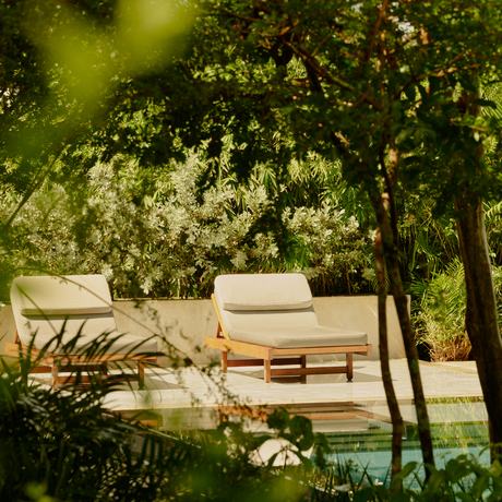 Casita with bay view pool at Amanera, framed by lush green foliage and trees.