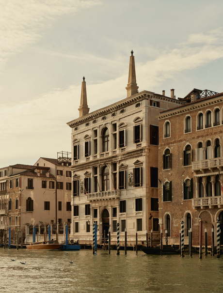 Venetian palazzo with twin spires reflected in the Grand Canal, Aman Venice.