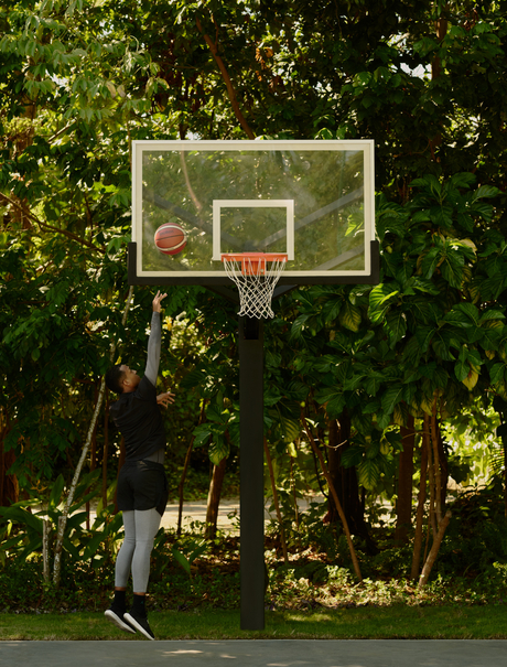 Basketball hoop surrounded by lush tropical foliage at Amanera, Dominican Republic.