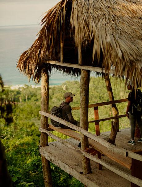 Wooden platform with thatched roof overlooking jungle at Amanera, Dominican Republic.