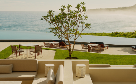Amanera resort pool terrace overlooking Dominican coastline with lounge seating and ocean views.