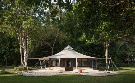 Amanwana jungle tent exterior surrounded by dense tropical forest in Sumbawa, Indonesia.