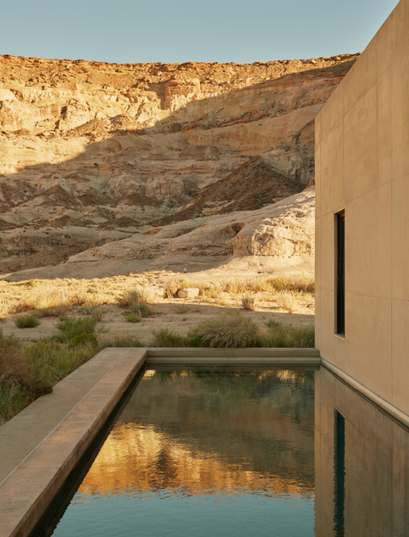 Girijaala Suite balcony overlooking a reflecting pool and desert landscape at Amangiri.