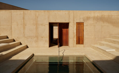 Plunge pool reflecting desert architecture at Amangiri wellness retreat, Utah.