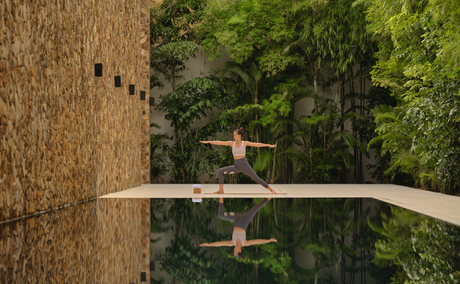 Lap pool at Amansara stretching through lush Cambodian jungle canopy.