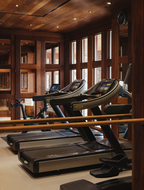 Spa and gym at Amangani with treadmills and wooden interior.