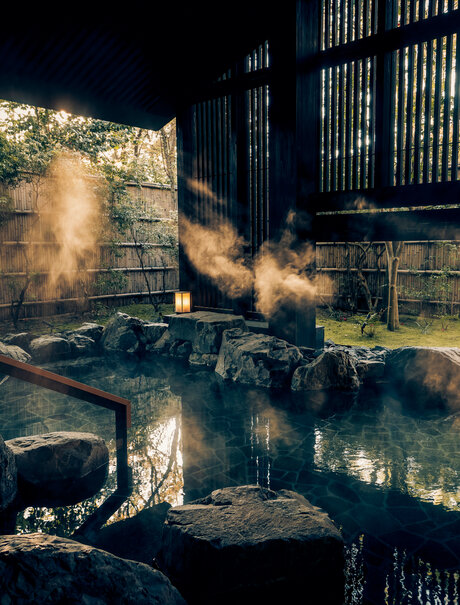 Onsen at Aman Kyoto at dawn with steam rising