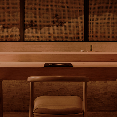 Wooden desk with chair and mirror at Aman Nai Lert Bangkok.