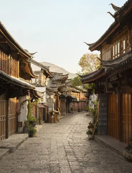 Stone-paved street lined with traditional wooden buildings in Lijiang Old Town, Amandayan.