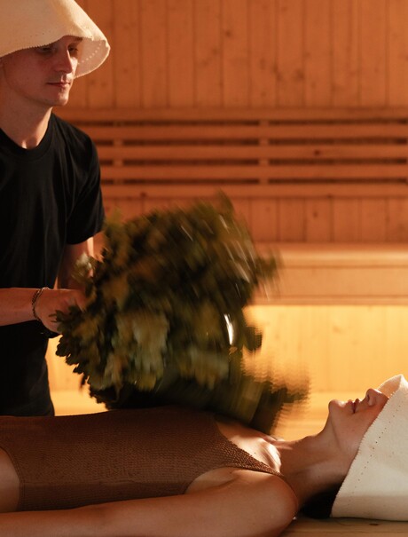 Therapist administering a Banya treatment at Amanpuri's spa house in Thailand.