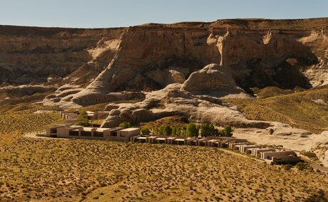 Aerial view of Amangiri's desert resort nestled among rust-coloured rock formations in Utah.