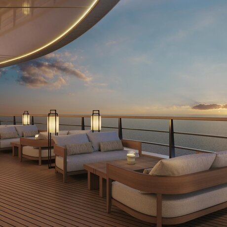 Jazz Bar at Aman overlooking the sea at dusk, with curved architectural elements and intimate seating.