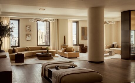 Principal bedroom suite at Aman New York penthouse with floor-to-ceiling windows and neutral furnishings.