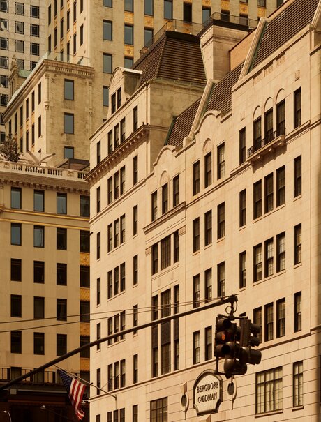 Neoclassical buildings in Manhattan with warm stone facades, Aman New York.