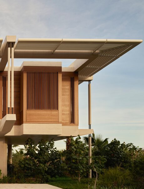 Horizon Casita at Amanvari with wooden façade and cantilevered shade structure overlooking Mexican landscape.