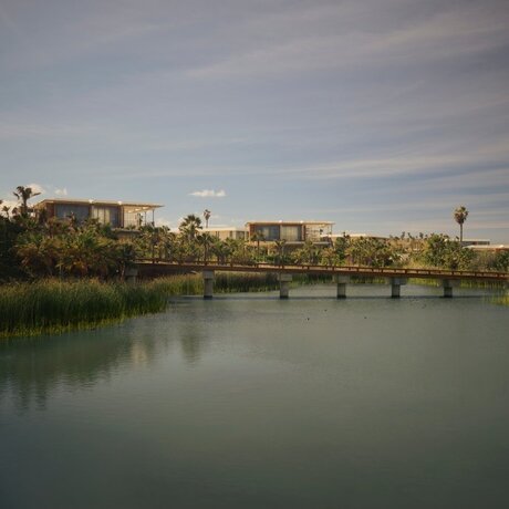 Casita exterior overlooking a tranquil river and distant landscape at Amanvari, Mexico.