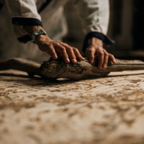 Studio portrait of artisan hands working with clay at Amanzoe, Greece.