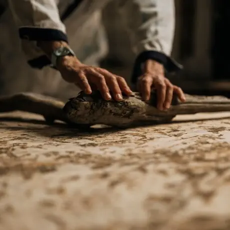 Studio portrait of artisan hands working with clay at Amanzoe, Greece.