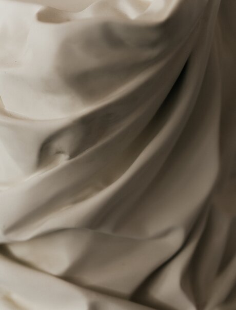 Studio portrait detail of fabric draping at Amanzoe, Greece.